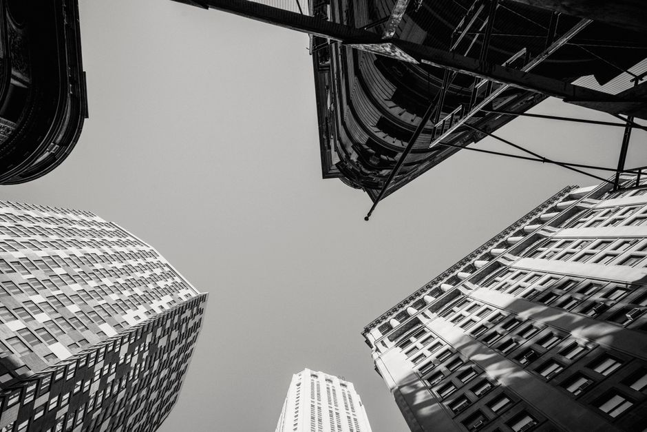 Black and white low angle of contemporary high multistory dwelling buildings located in city district