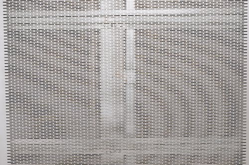 Metal gray grill texture with holes