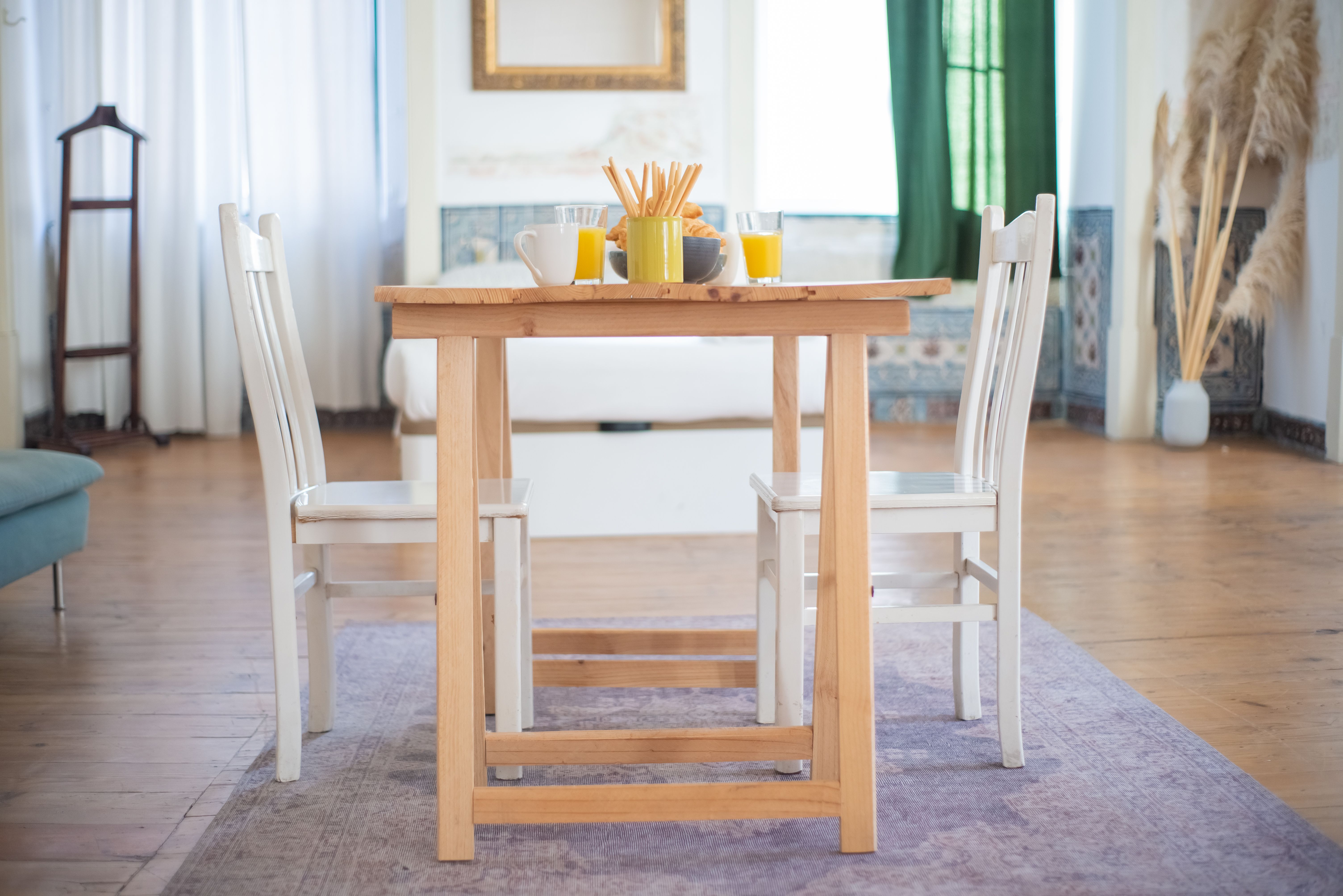 Inviting dining area with wooden table and breakfast setup, perfect for a cozy morning ambiance.