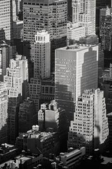 Black and white drone view of architecture of New York street with multistage towers