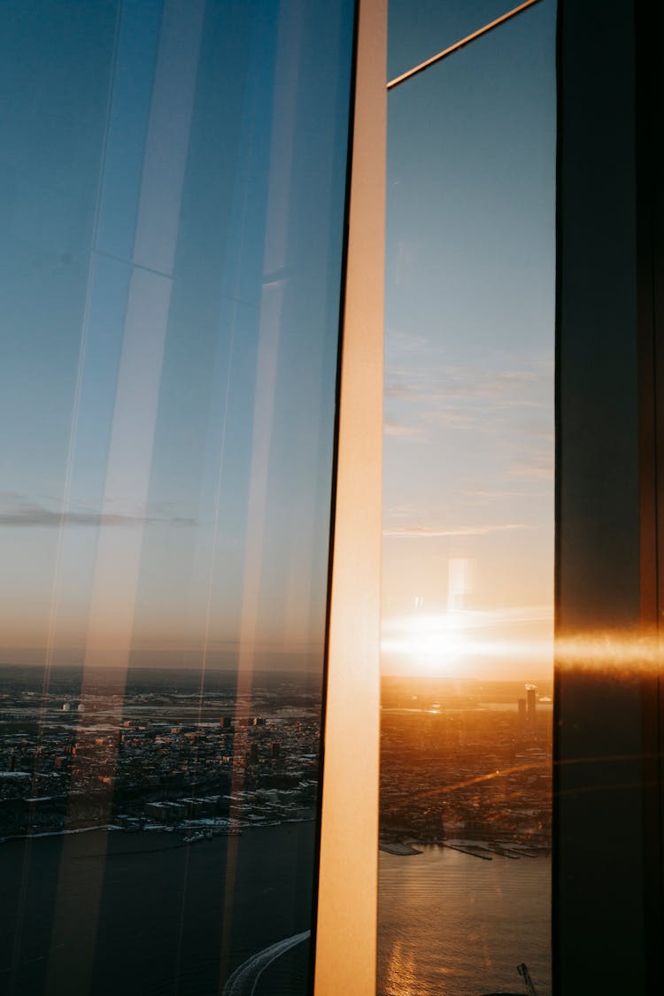 Reflection Of Modern City In Window