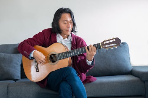 A Man Playing an Acoustic Guitar