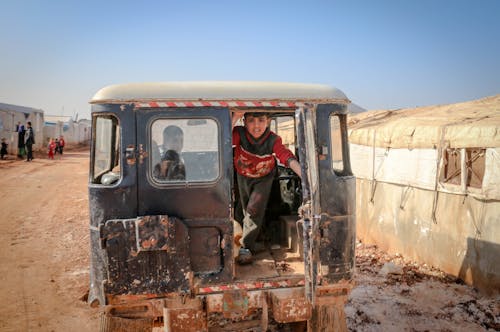 Boys Inside a Jeep