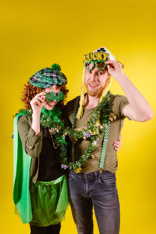 A Couple Posing In Their Costumes