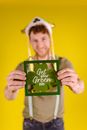 A Man Holding A Framed Clover Leaf