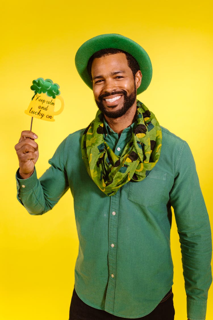 Smiling Man Holding A Prop 