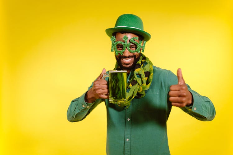 Man Wearing Green Prop Holding A Green Beer 