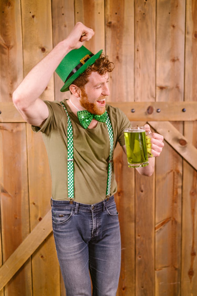 Groovy Man Holding A Jug Of Green Beer 