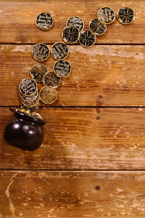 Gold Coins on Wooden Surface 