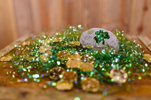 Vibrant St. Patrick's Day decor featuring gold coins and shamrock embellishments on a wooden table.