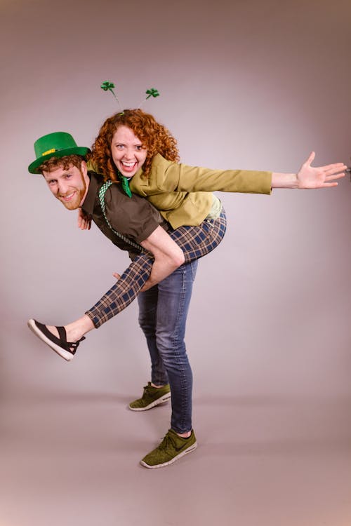 Happy Man and Woman wearing St. Patrick's Day Props