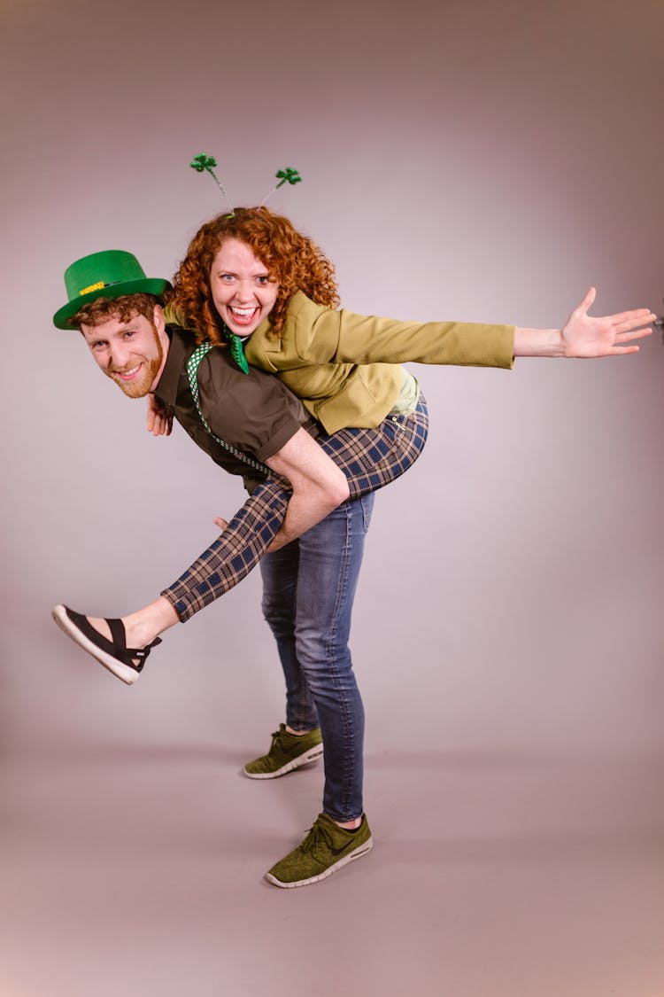 Happy Man And Woman Wearing St. Patrick's Day Props