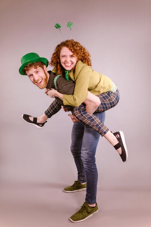 Free Happy couple in festive outfits enjoying St. Patrick's Day fun. Stock Photo