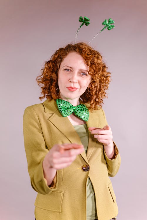Woman in a Green Blazer Pointing with Her Fingers