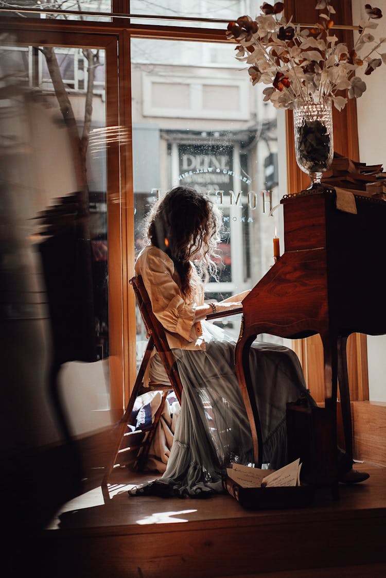 Faceless Woman At Vintage Writing Cabinet