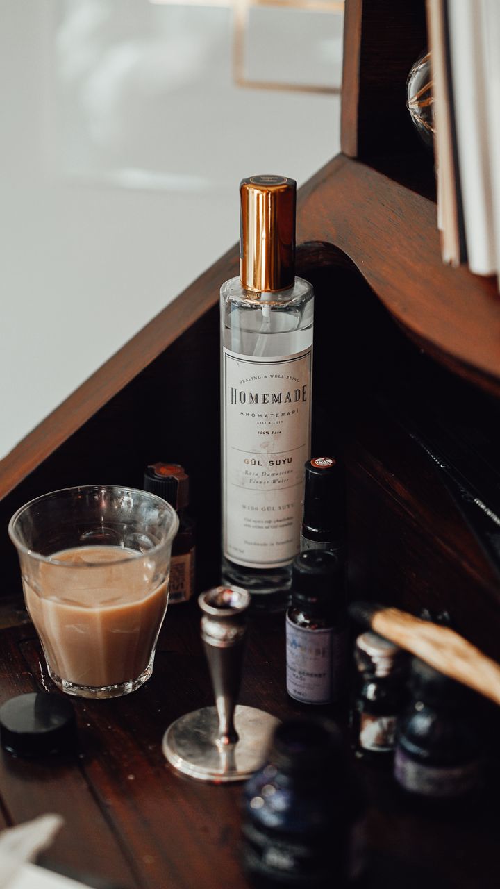 antique apothecary armoire converted to a coffee station with labeled glass jars