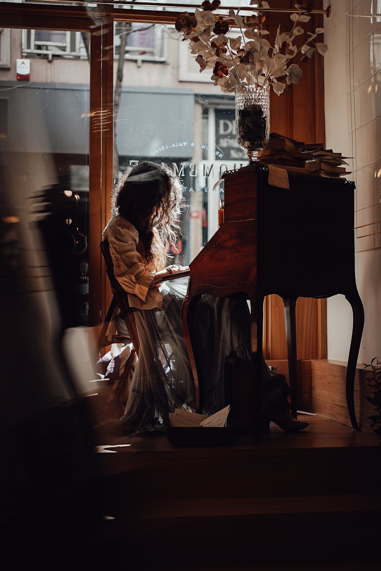 Faceless Woman At Writing Cabinet In Vintage Styled Store