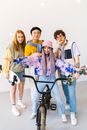 Woman Sitting on Bike Together with Her Friends