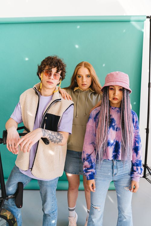 Free Vibrant group of trendy young models in a studio photoshoot. Stock Photo