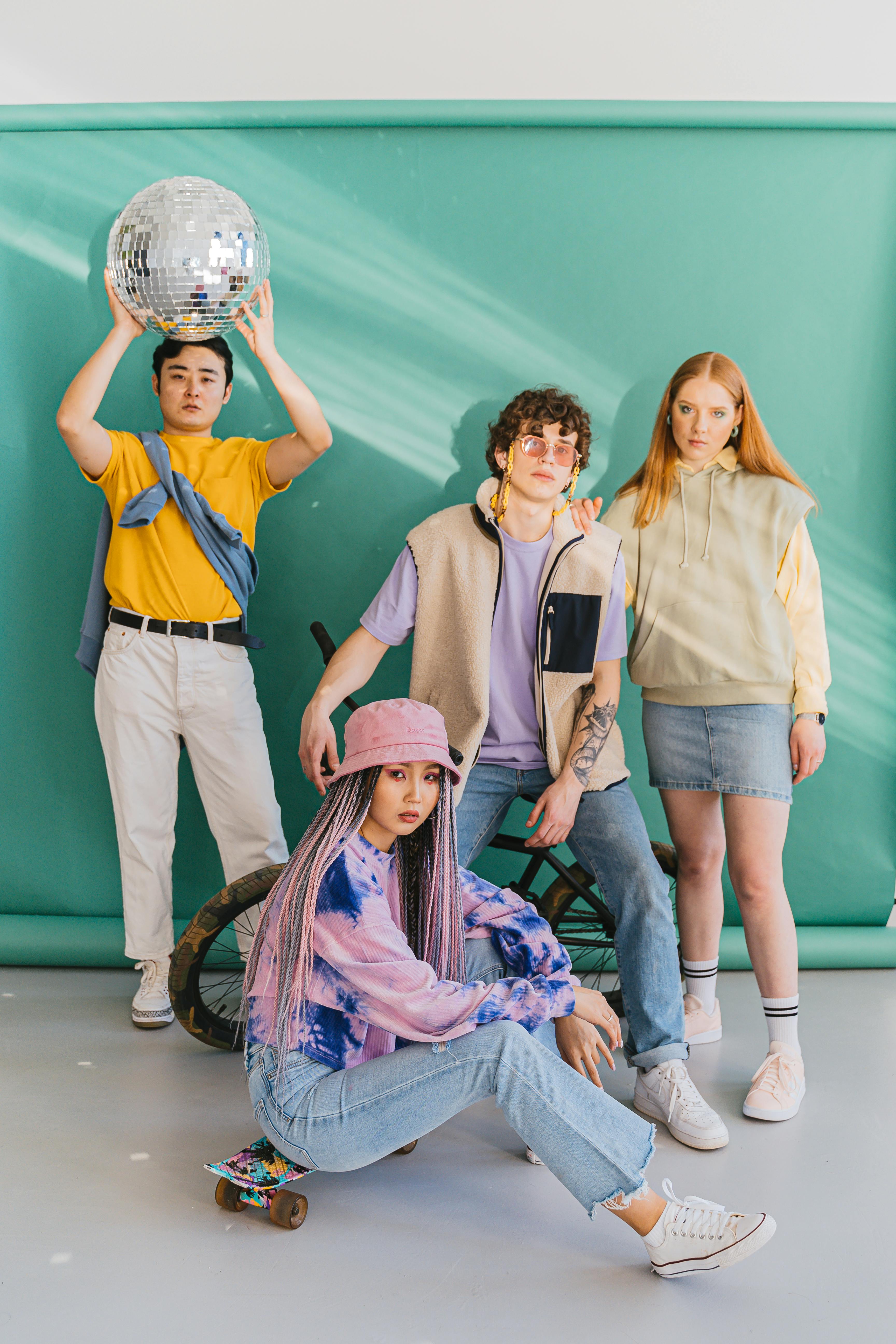 a group of people posing in front of backdrop