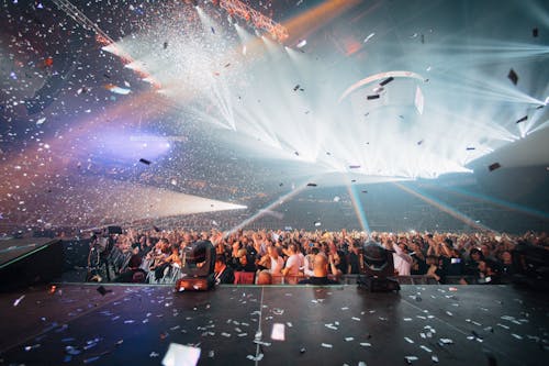 A Crowd in a Live Performance with Confetti Falling