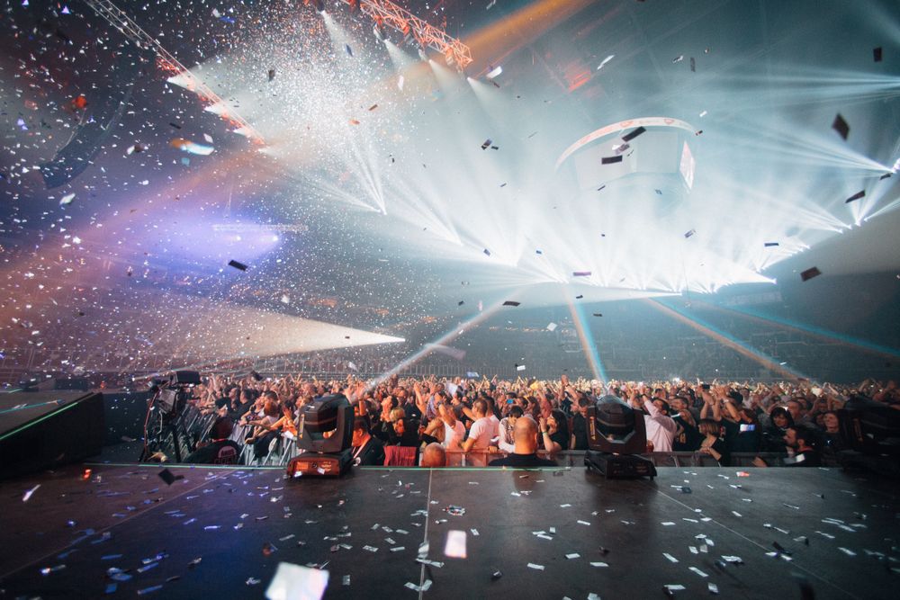 Confetti falling over a cheering celebration crowd
