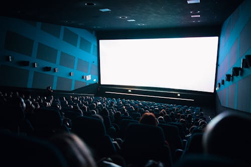 High-Angle Shot of People Watching Movie Inside the Theater