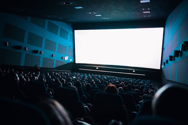 High-Angle Shot Of People Watching Movie Inside The Theater