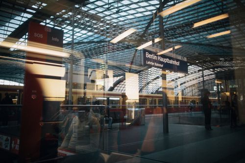 Free View of Berlin Hauptbahnhof reflected through glass with people in motion. Stock Photo