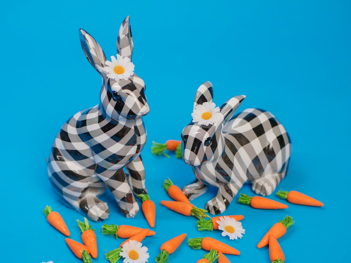 Two Checkered Rabbits with Flowers Between Their Ears