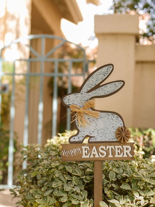 Free Outdoor Easter bunny sign in a garden, celebrating the spring season. Stock Photo