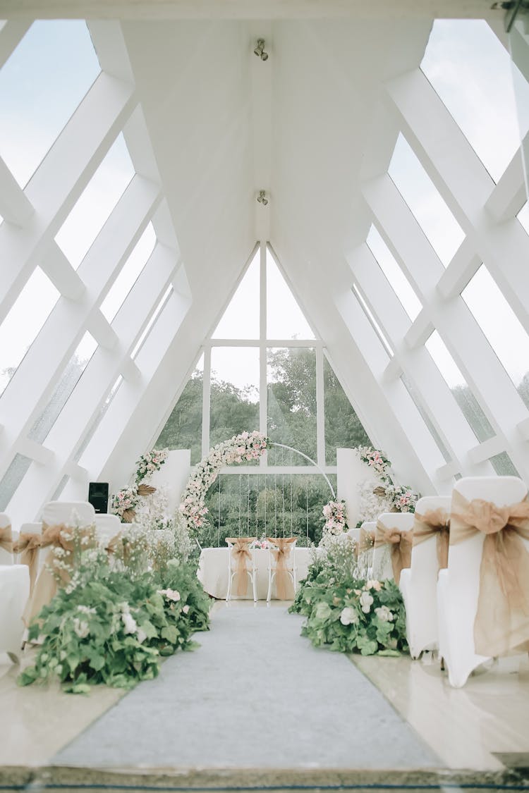 Decorated Aisle For Wedding Ceremony With High Ceiling 