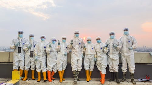 Free A Group of People Wearing Personal Protective Equipment Stock Photo