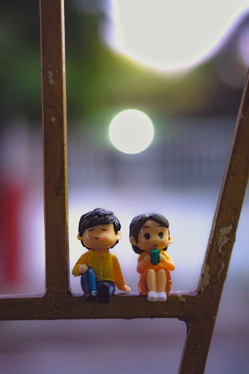 Cute figurines on metal construction