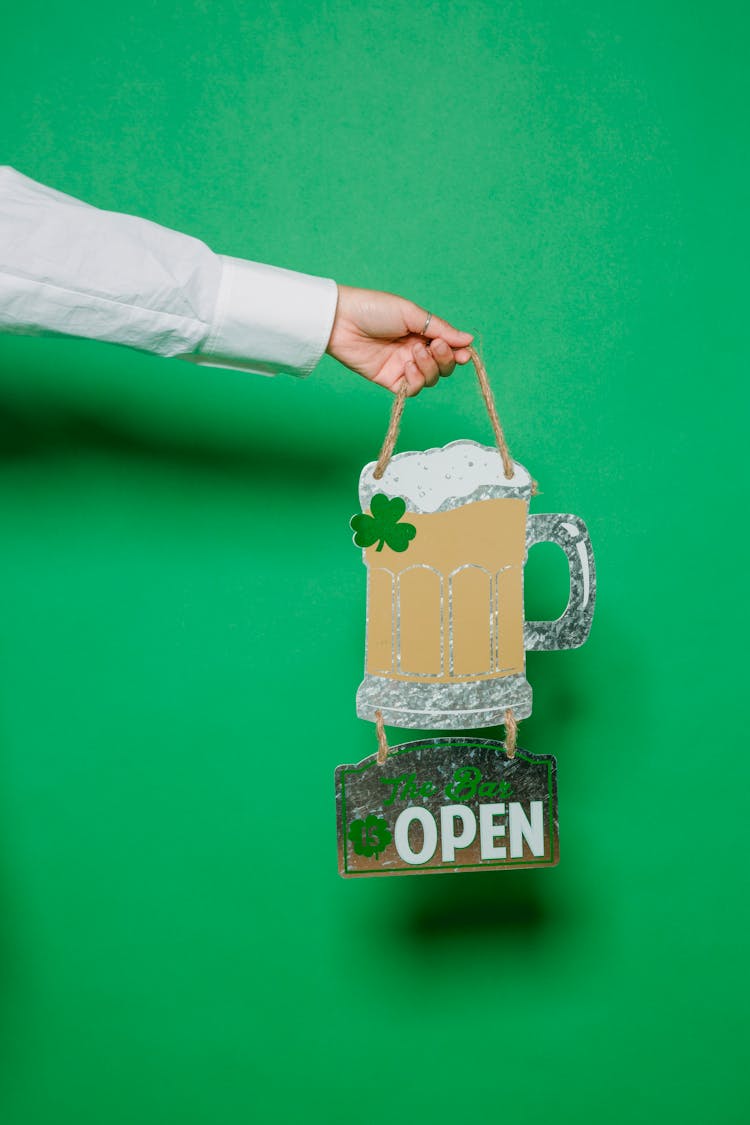 Crop Person Holding Creative Signboard