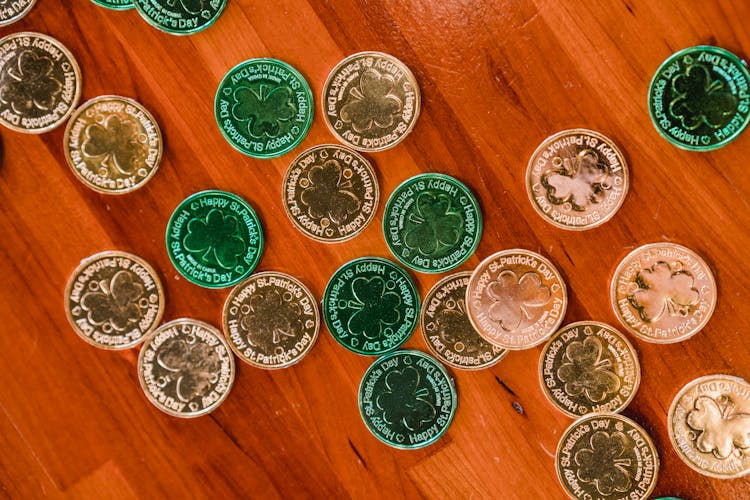 Golden And Green St Patricks Day Coins On Wooden Floor