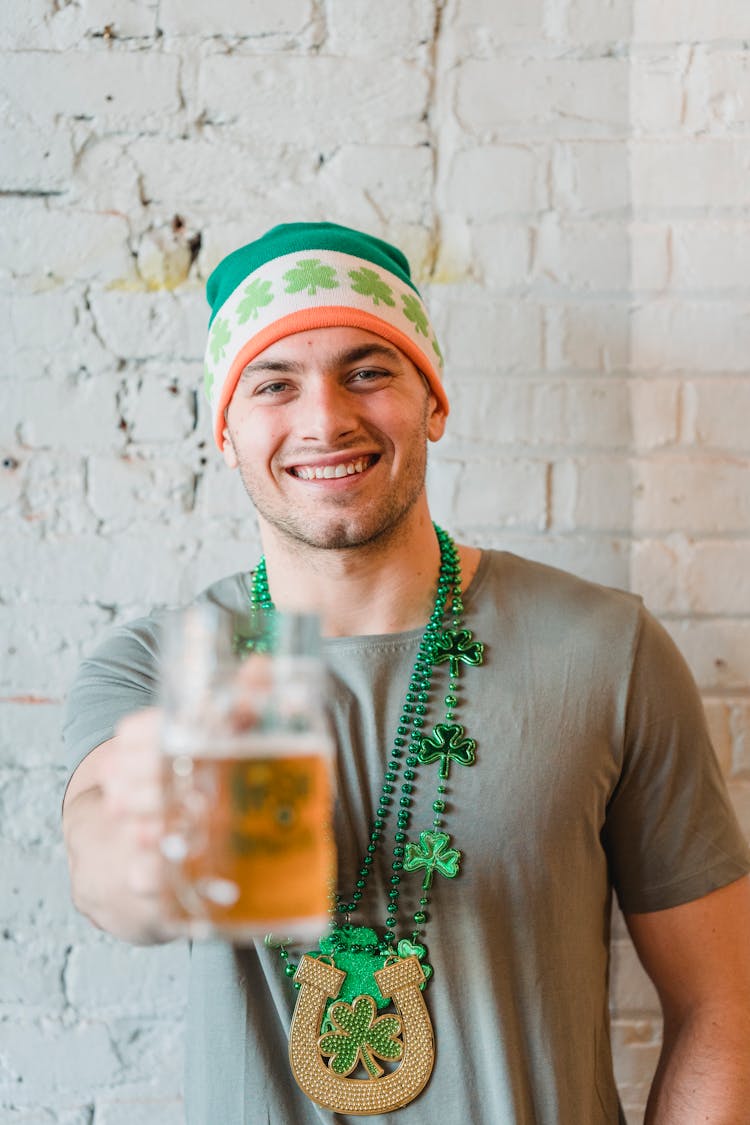 Smiling Man In Hat Holding Beer