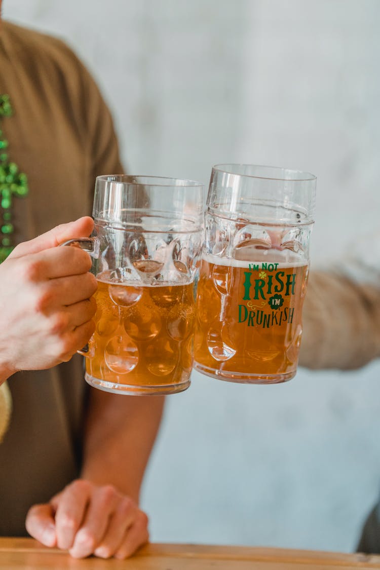 Hands Toasting Beer Mugs 