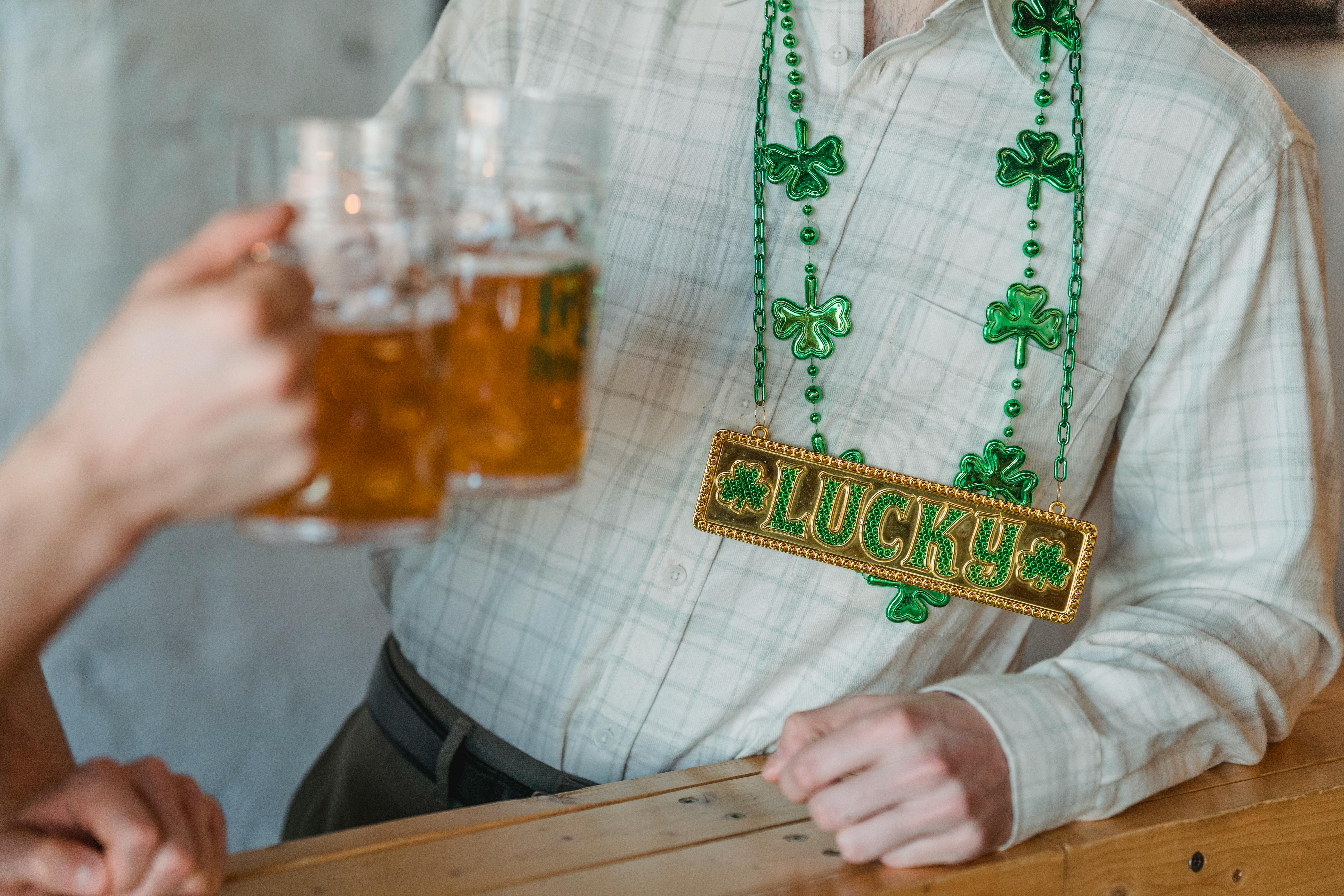 People toasting with beer mugs during a festive Saint Patrick's Day celebration.