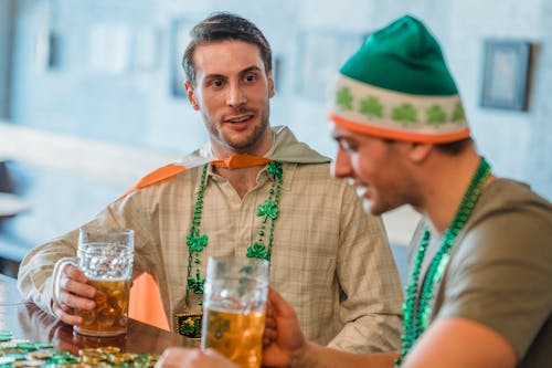 Selective Focus of a Man Holding a Glass of Beer during Saint Patrick's Day