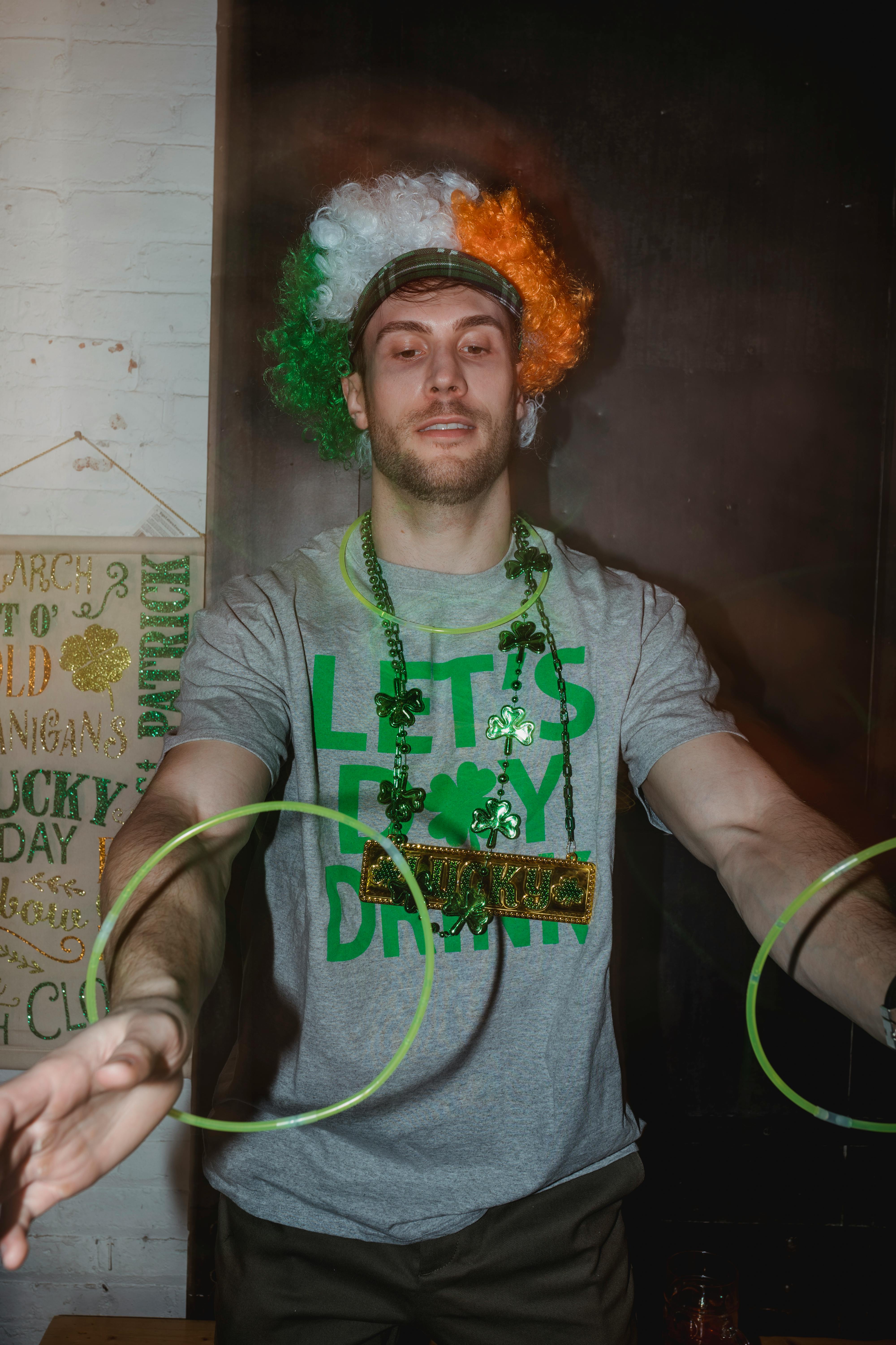 attentive man in wig spinning rings