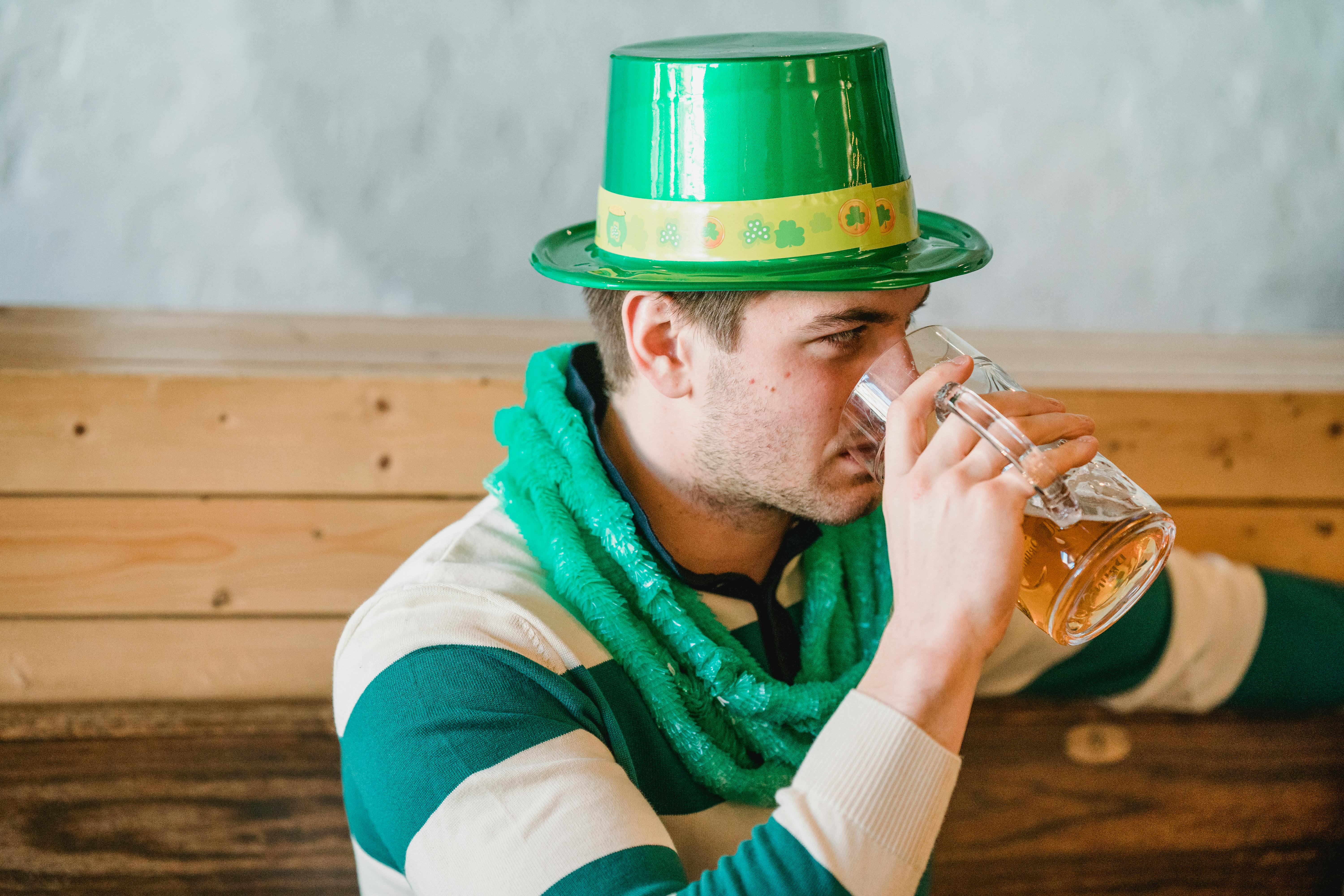 man drinking beer during feast of saint patrick