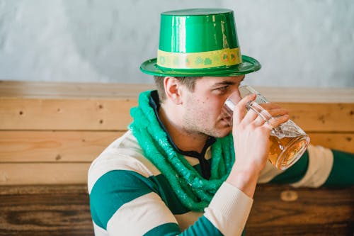 Man drinking beer during Feast of Saint Patrick