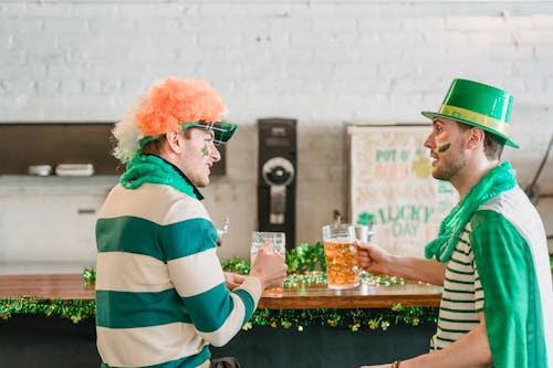 Friends with beer talking during Feast of Saint Patrick