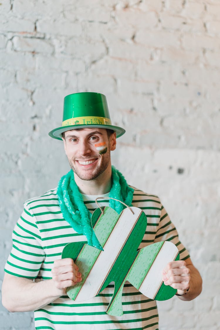 Cheerful Man Showing Sign With Clover On St Patricks Day