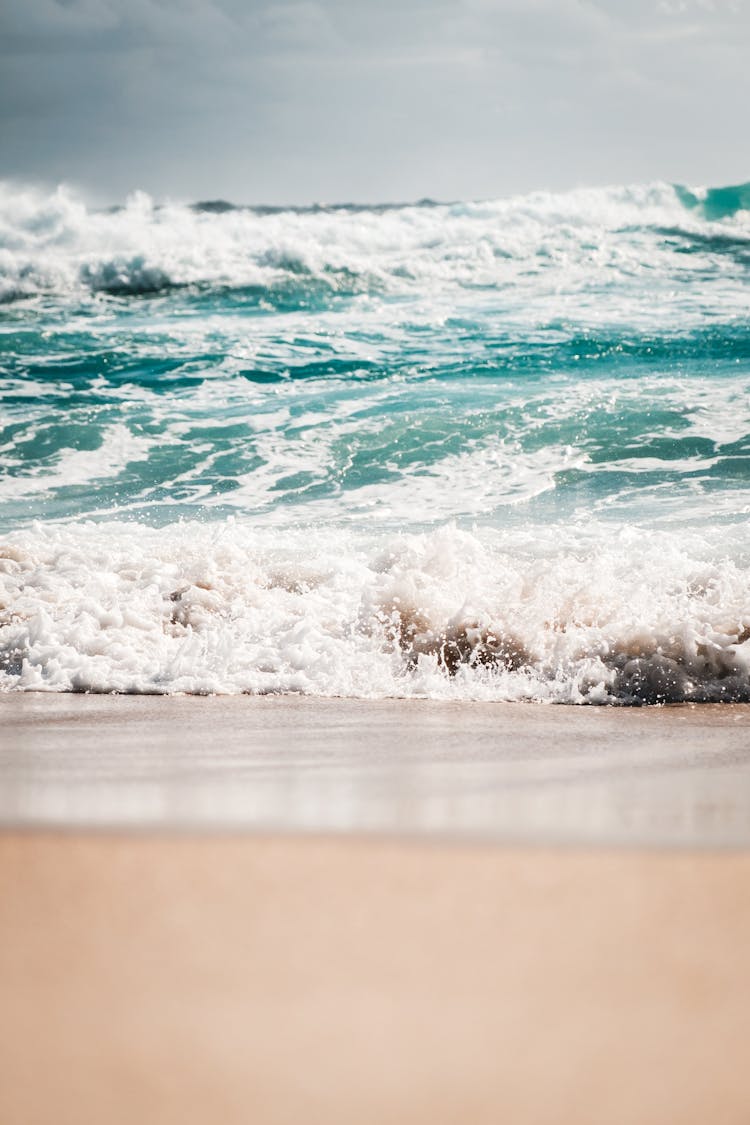 Azure Foamy Sea Washing Sandy Coast