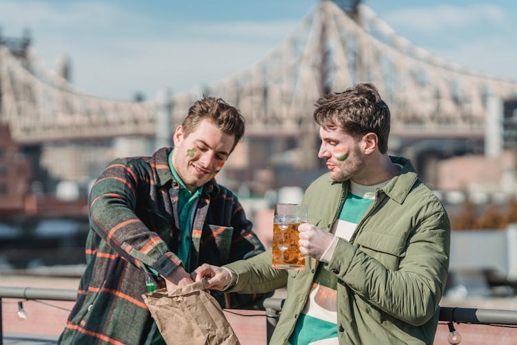 Men With Food And Beer During Saint Patricks Day In City