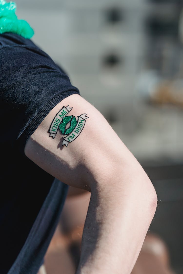 Crop Irish Man With Temporary Tattoo On Arm