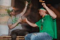 Happy friends celebrating national holiday drinking beer