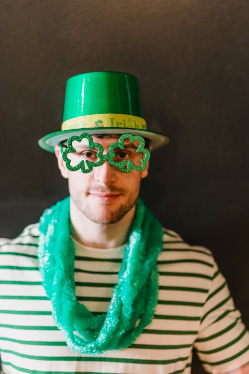 Trendy man wearing clothes and accessories of national Irish colors